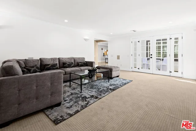 a living room with furniture and a rug