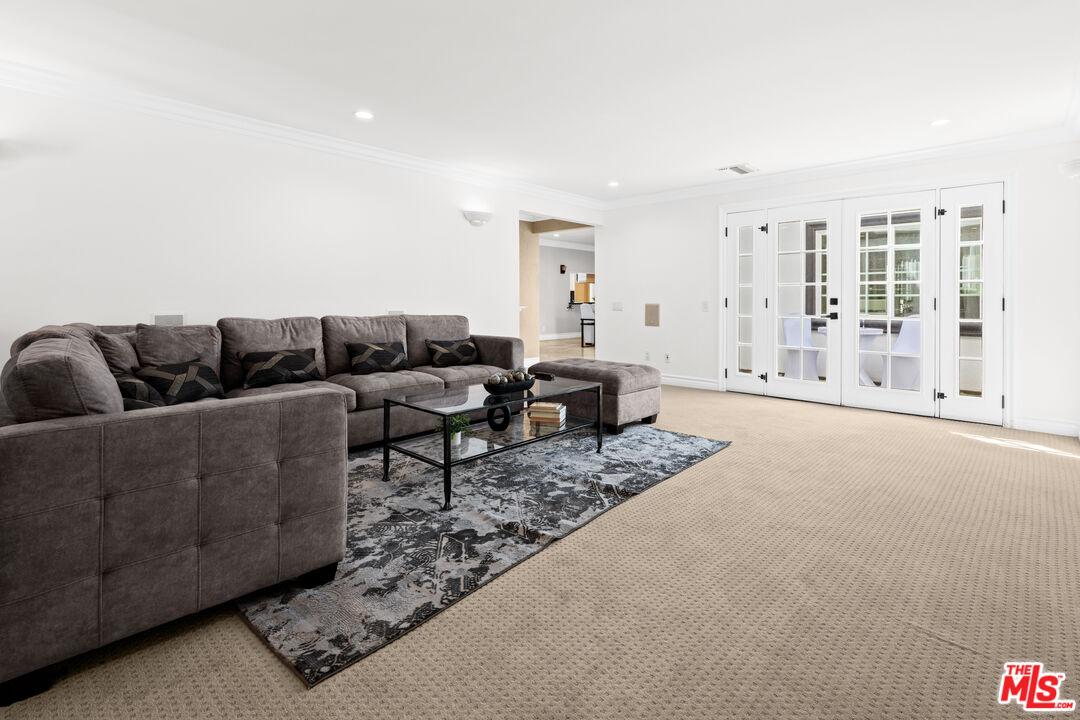 2563 Hutton Drive Beverly Hills, CA 90210 - Photo 8 of 69 a living room with furniture and a rug