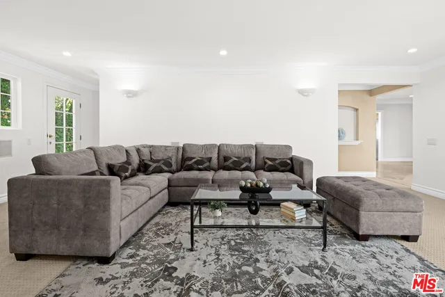 a living room with a couch and a window