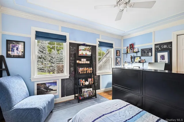 a bedroom with furniture and a window