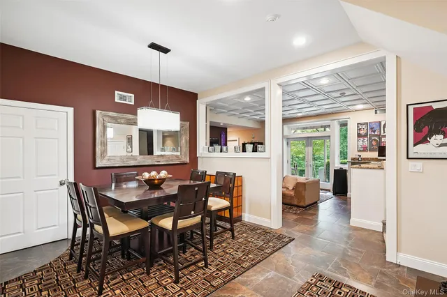 a dining room with furniture and window