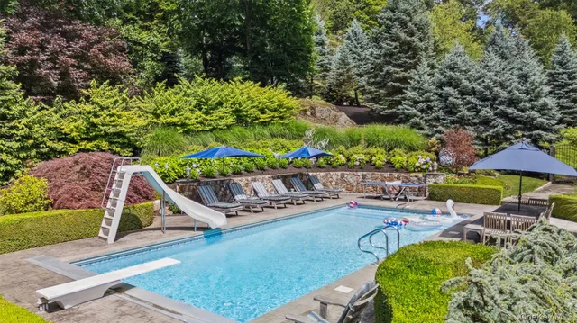 a view of a backyard with sitting area