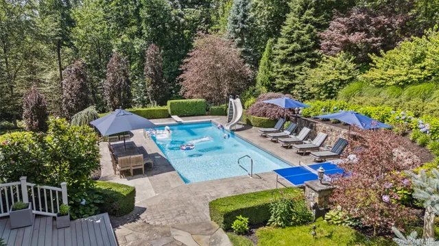 a view of a chairs and table in the patio