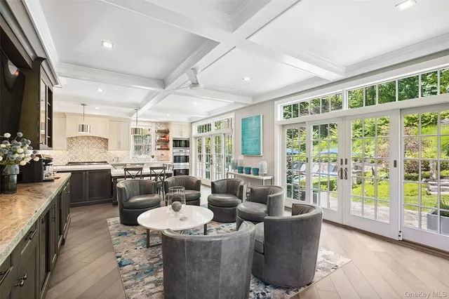 a living room with couches a coffee table and chairs
