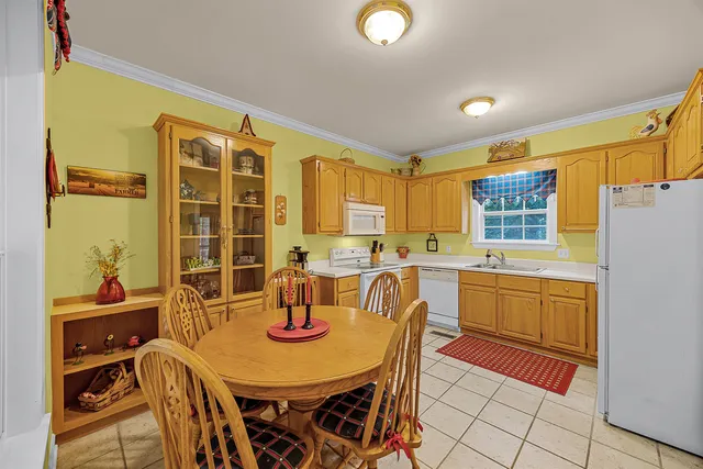 a view of a dining room with furniture and window