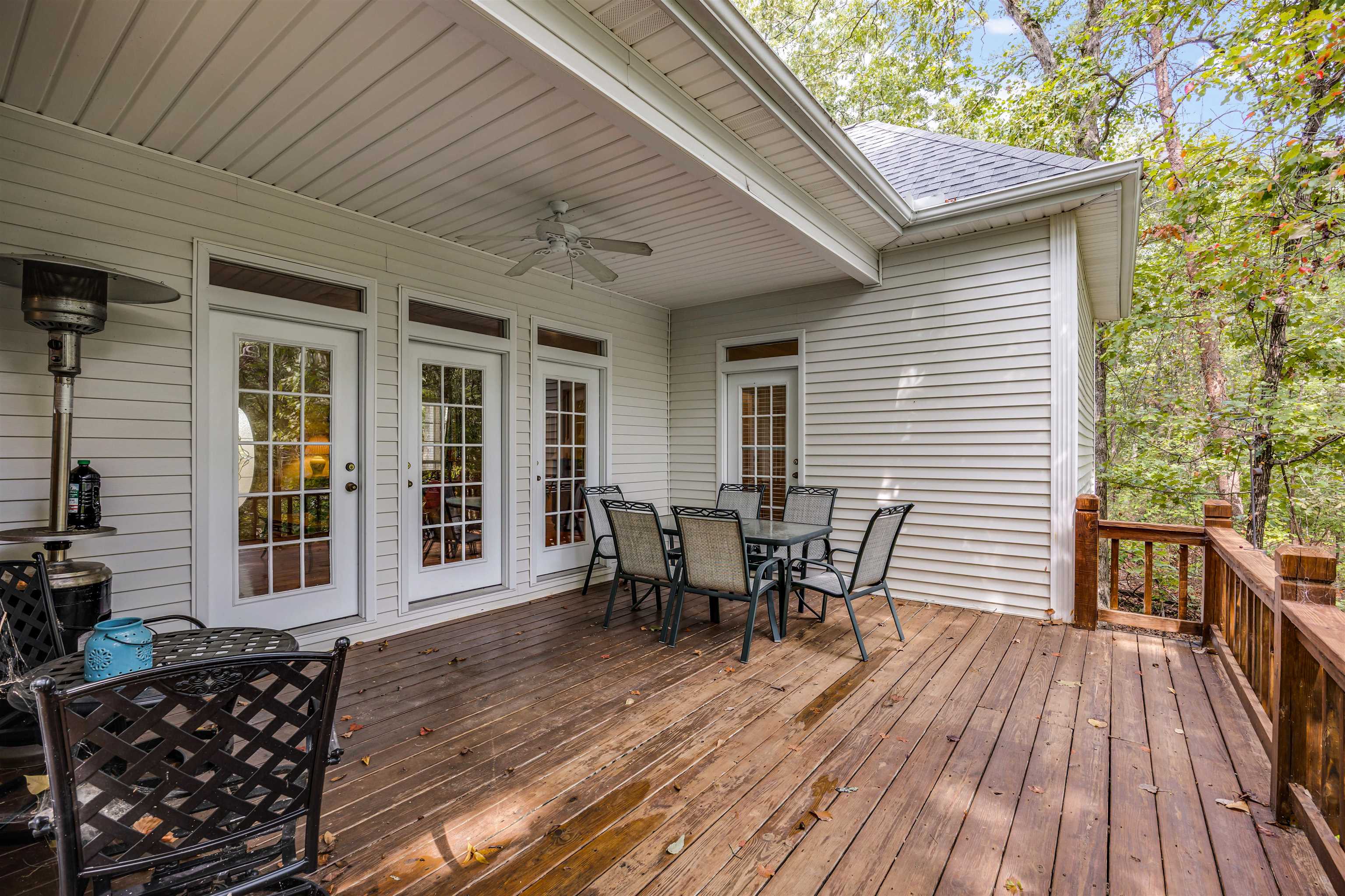 405 Anderson Hollow Road Savannah, TN 38372 - Photo 15 of 34 a view of a patio with table and chairs and wooden floor