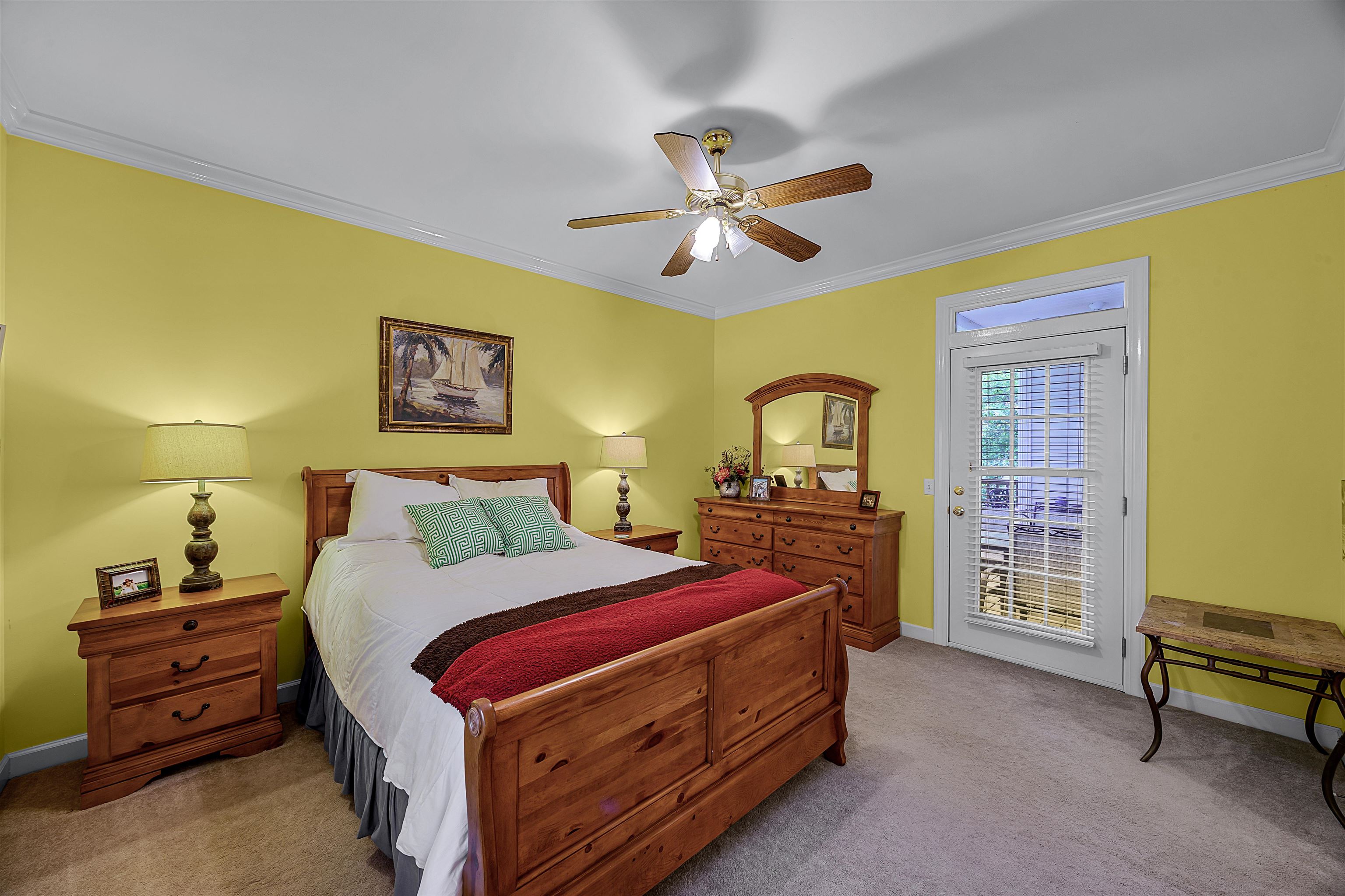 405 Anderson Hollow Road Savannah, TN 38372 - Photo 18 of 34 a bedroom with a bed and a chandelier