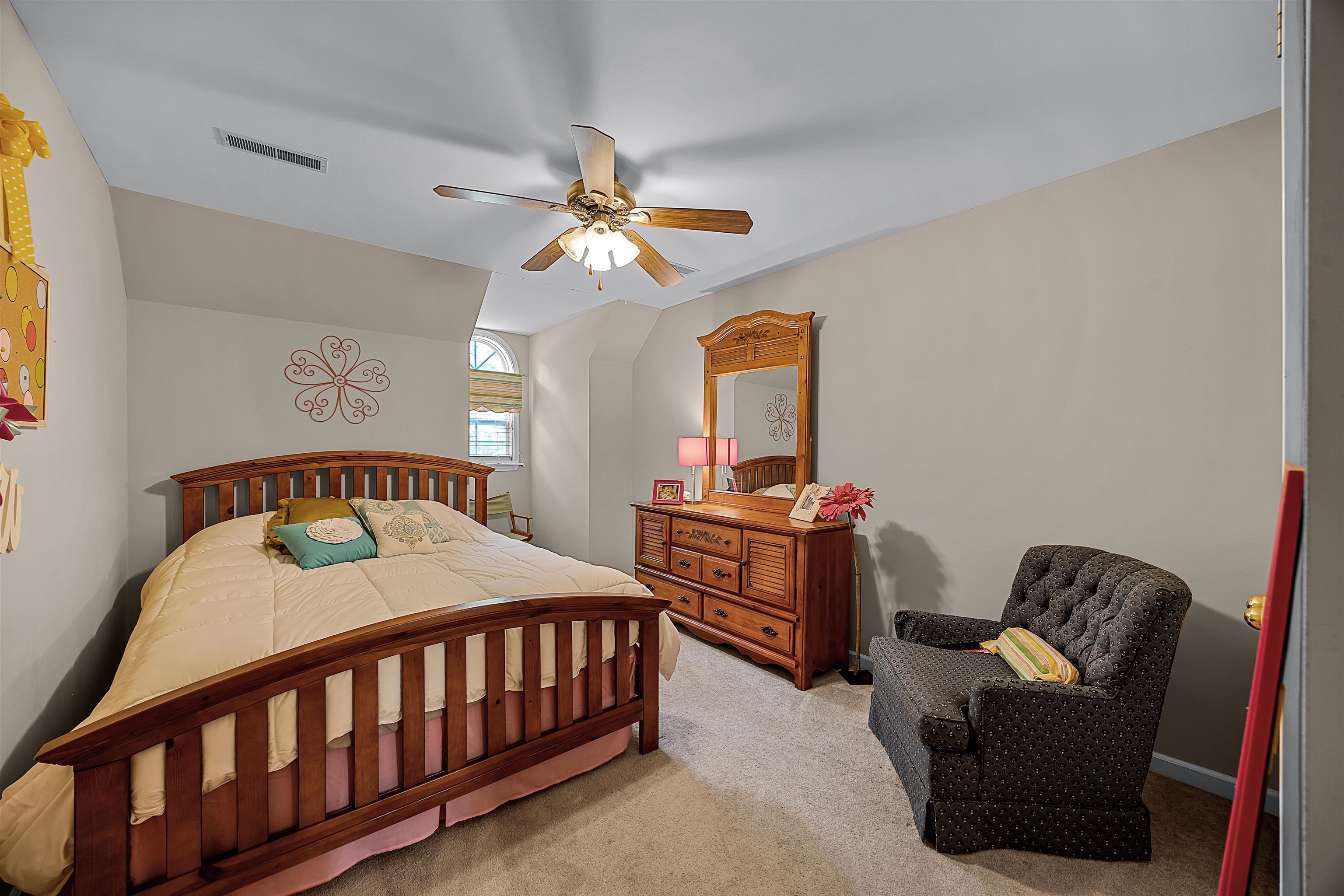 405 Anderson Hollow Road Savannah, TN 38372 - Photo 20 of 34 a bedroom with a bed and a chandelier