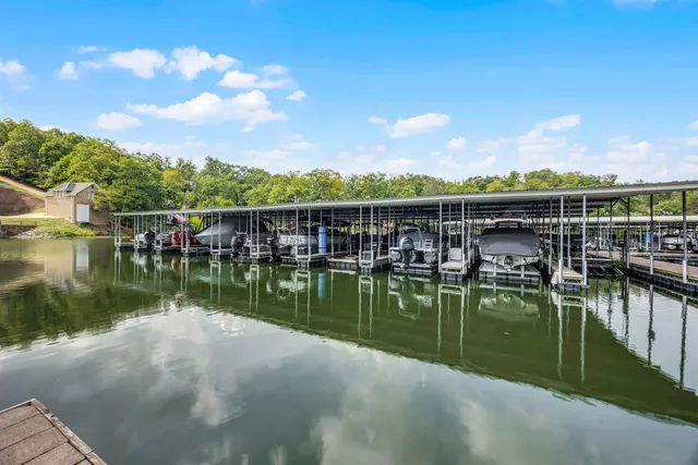 a view of a lake with a house in the background