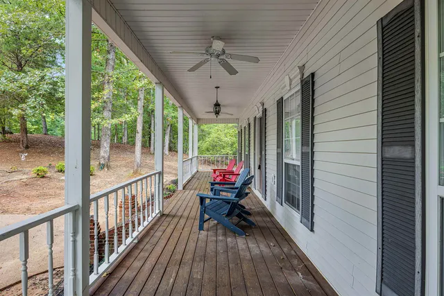 a view of a porch with wooden floor and outdoor space