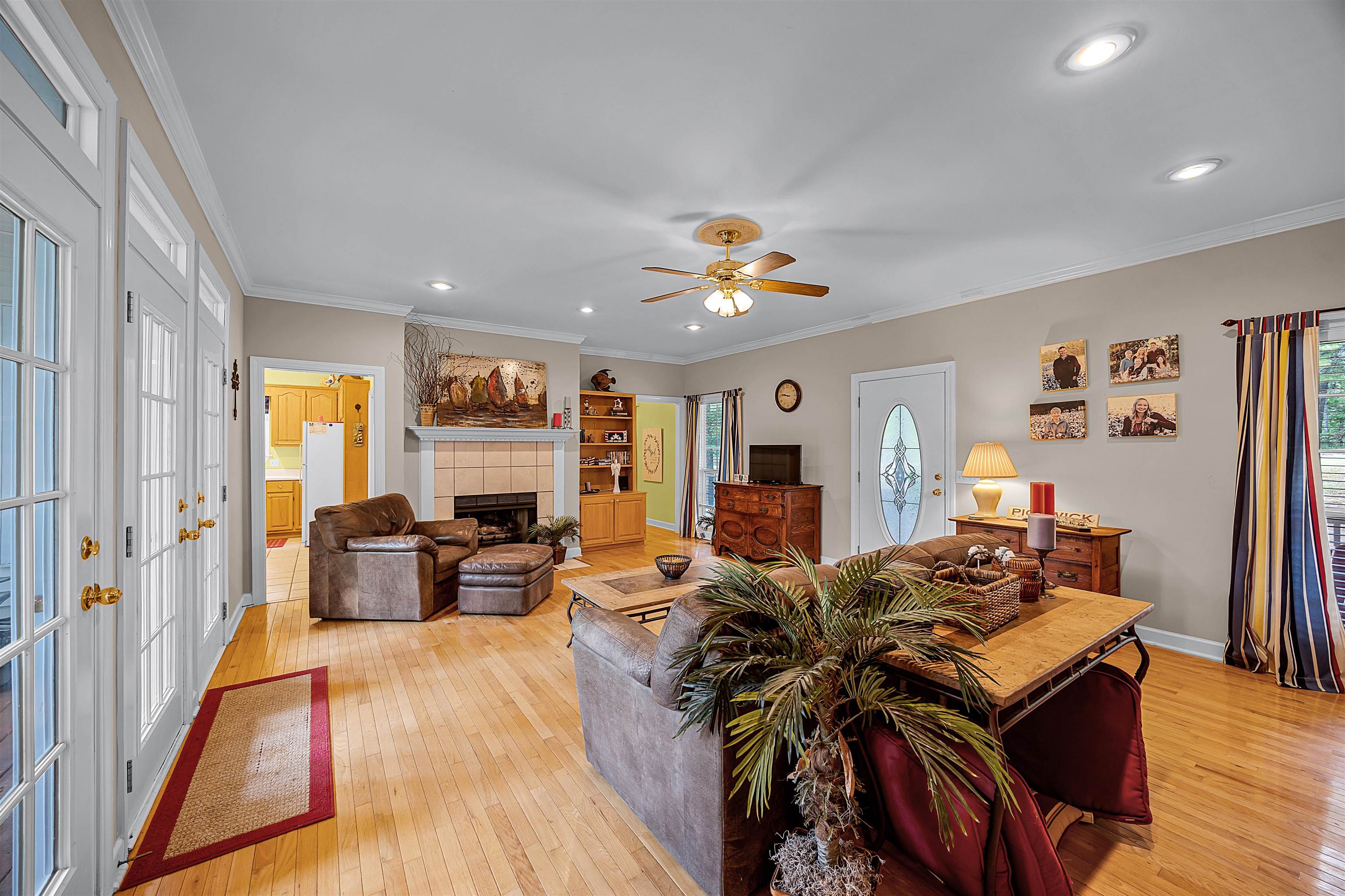 405 Anderson Hollow Road Savannah, TN 38372 - Photo 8 of 34 a living room with fireplace furniture and a wooden floor