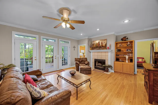 a living room with furniture fireplace and flat screen tv
