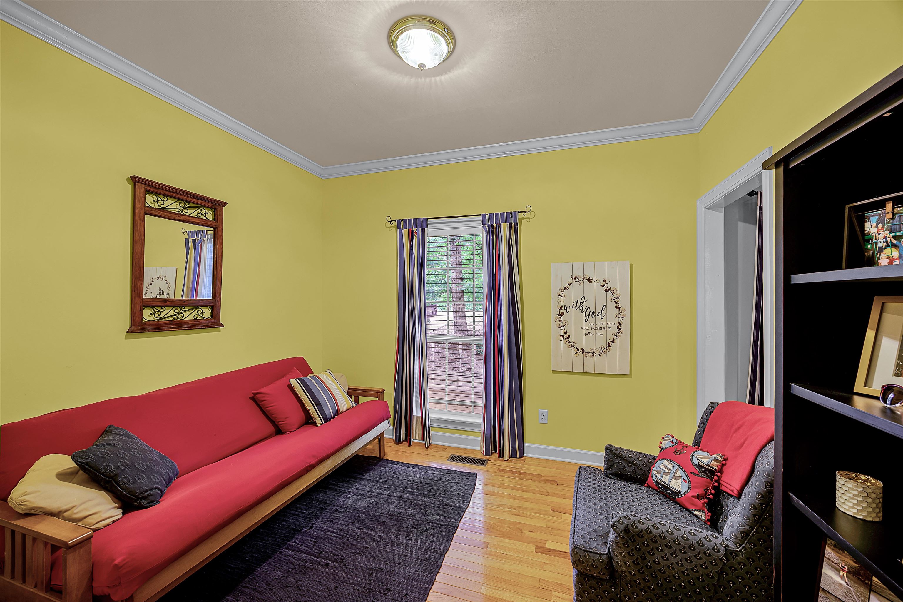 405 Anderson Hollow Road Savannah, TN 38372 - Photo 10 of 34 a living room with furniture and a flat screen tv