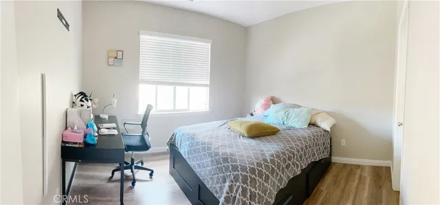 a bedroom with a bed and a table in it