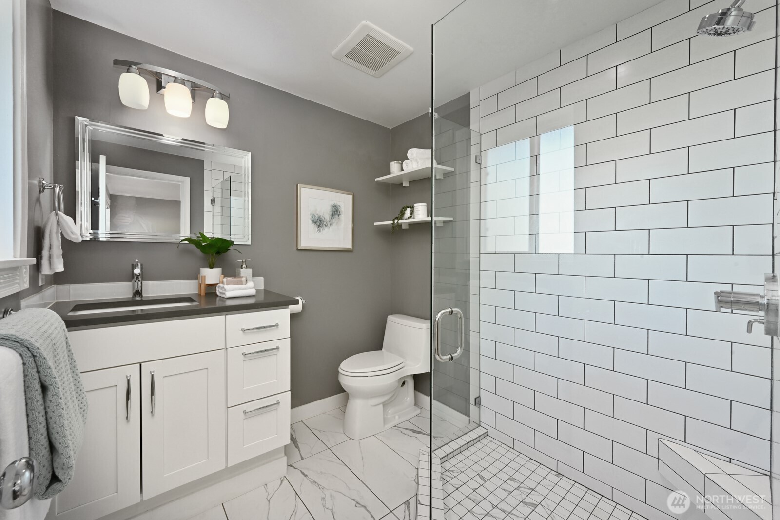 2525 South Raymond Street Seattle, WA 98108 - Photo 16 of 38 a bathroom with a sink a toilet and mirror
