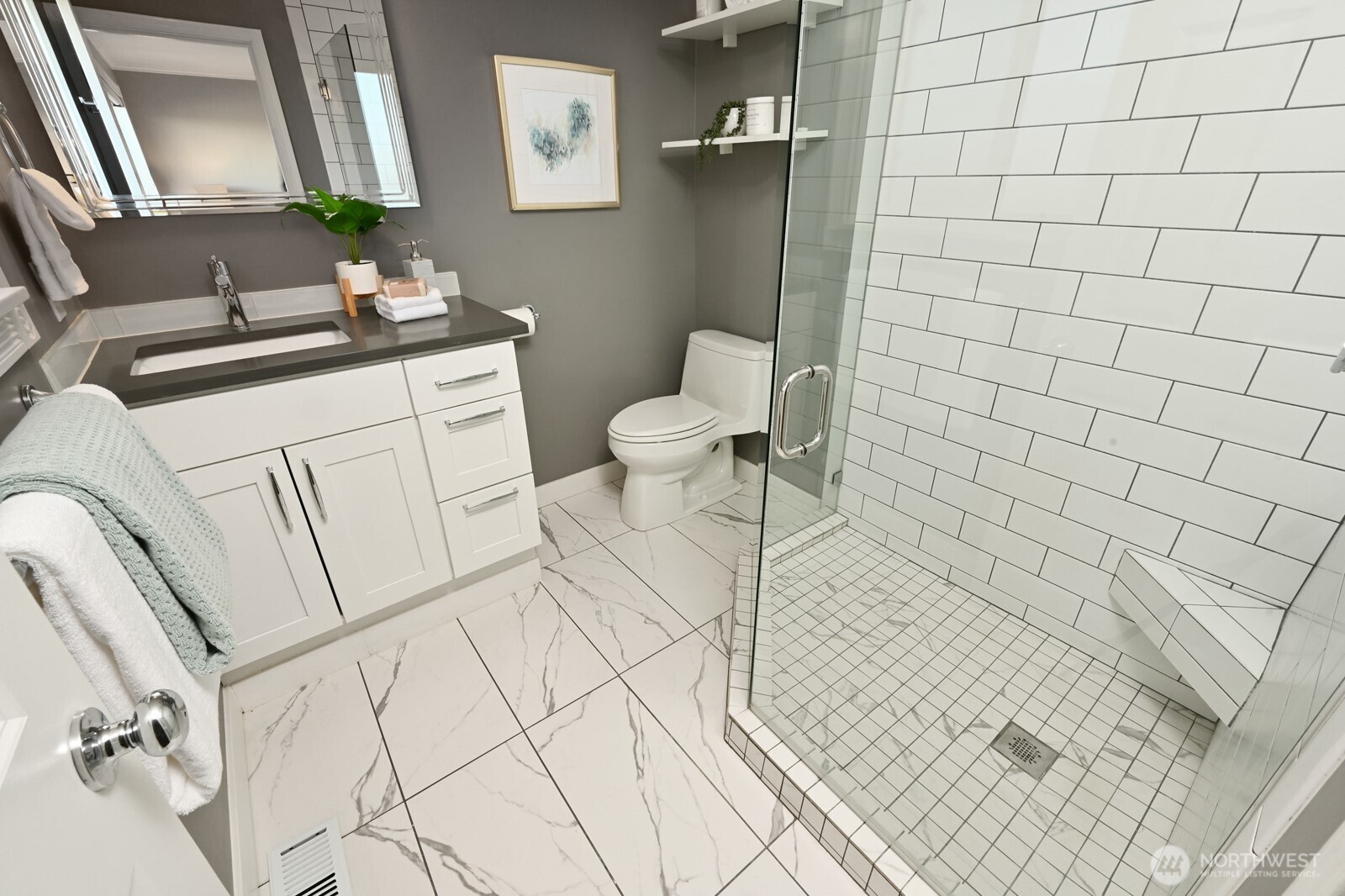 2525 South Raymond Street Seattle, WA 98108 - Photo 17 of 38 a bathroom with a sink a toilet and mirror