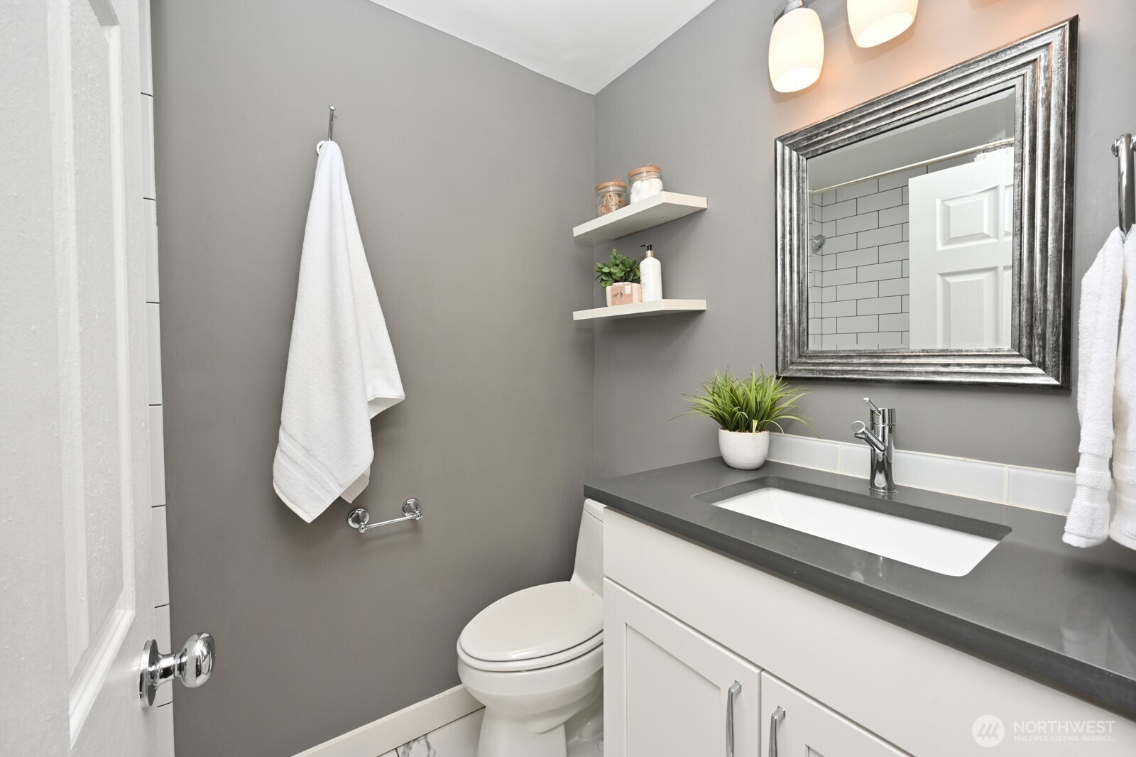 2525 South Raymond Street Seattle, WA 98108 - Photo 20 of 38 a bathroom with a sink a toilet and a mirror