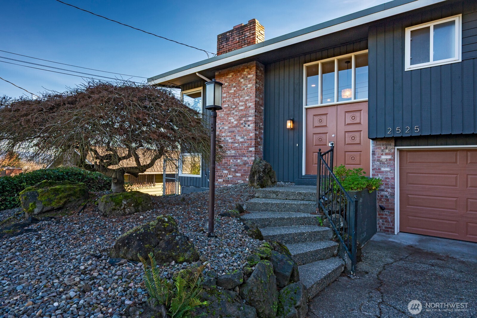 2525 South Raymond Street Seattle, WA 98108 - Photo 2 of 38 a front view of a house with garden