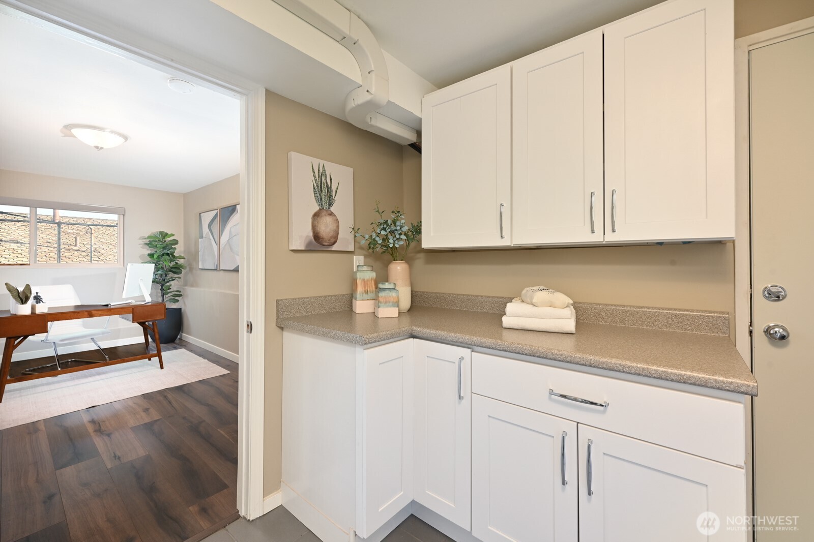 2525 South Raymond Street Seattle, WA 98108 - Photo 25 of 38 a kitchen with granite countertop white cabinets and white appliances