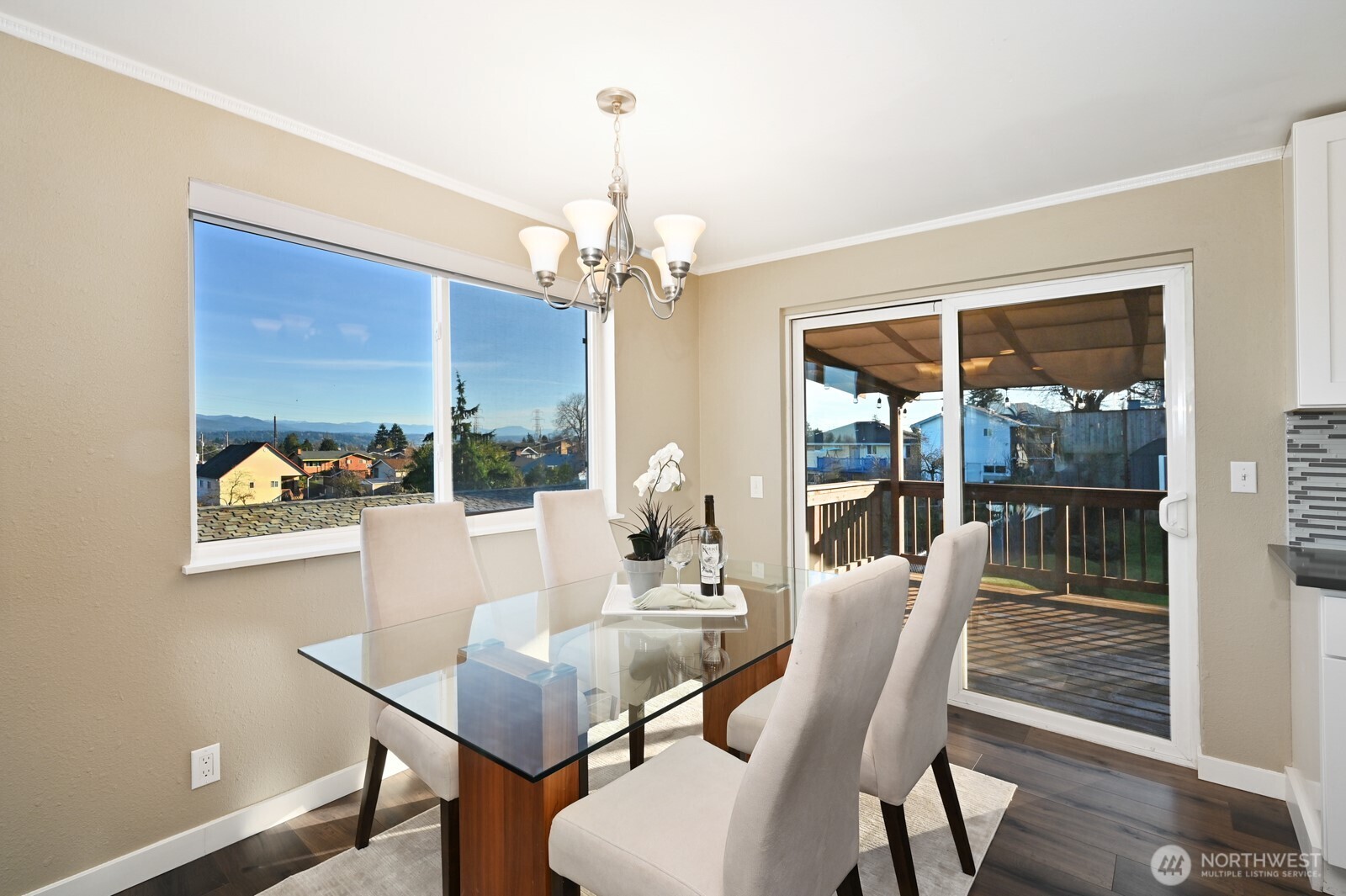 2525 South Raymond Street Seattle, WA 98108 - Photo 9 of 38 a dining room with furniture a chandelier and wooden floor