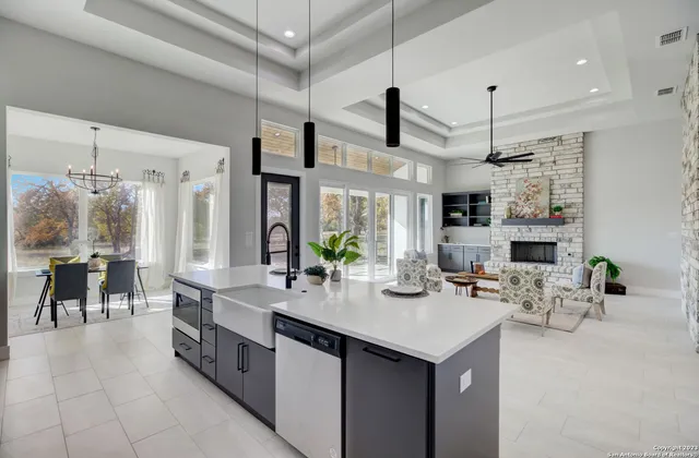 a kitchen with stainless steel appliances a sink stove and cabinets