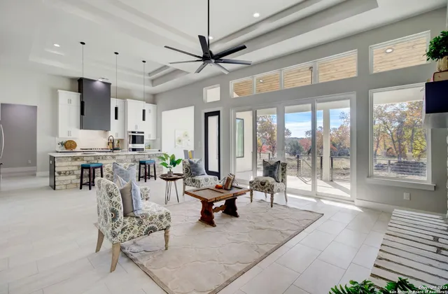 a living room with furniture and a large window