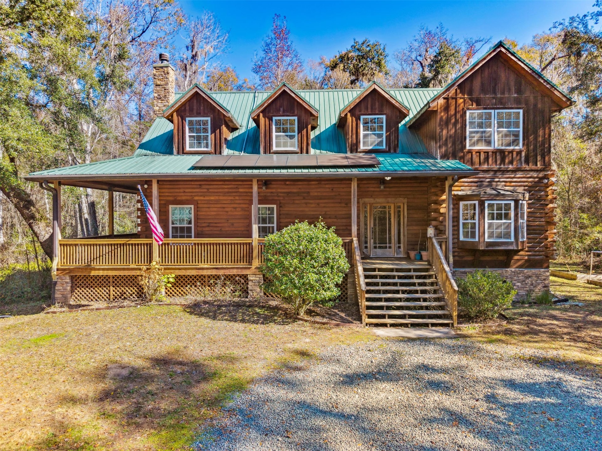 86205 Pages Dairy Road Yulee, FL 32097 - Photo 50 of 56 front view of a house with a street