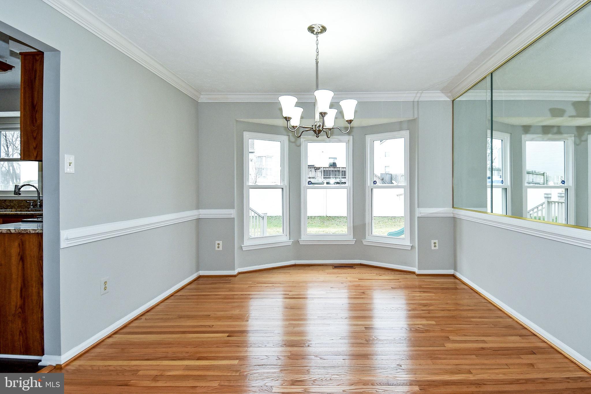 1867 Montreal Road Severn, MD 21144 - Photo 8 of 43 DINING ROOM HAS CROWN MOLDING AND REFINISHED FLOOR