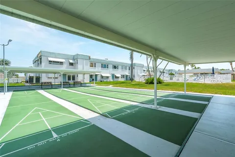 a view of an house with swimming pool and yard in the back