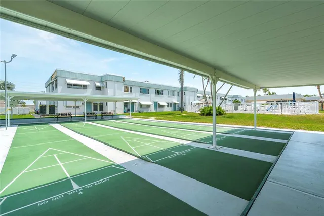a view of an house with swimming pool and yard in the back