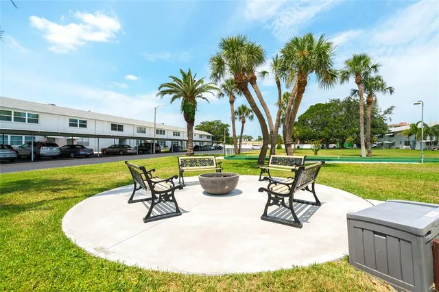 a view of a swimming pool and lounge chairs