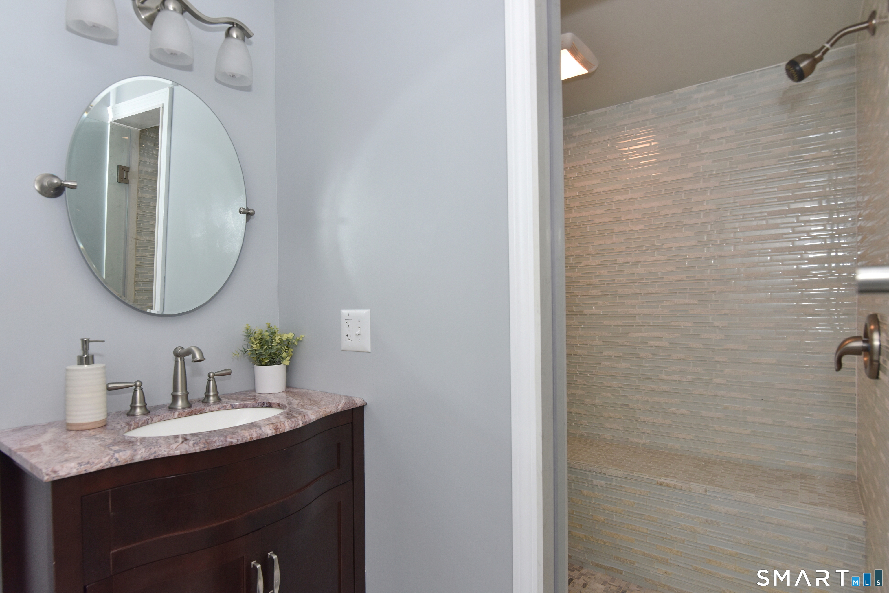 80 West Quasset Road Woodstock, CT 06281 - Photo 22 of 38 Beautifully finished bathroom on lower level includes a stall shower.