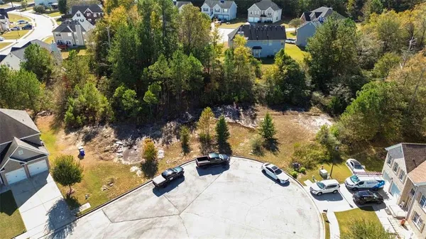 a view of yard along with trees
