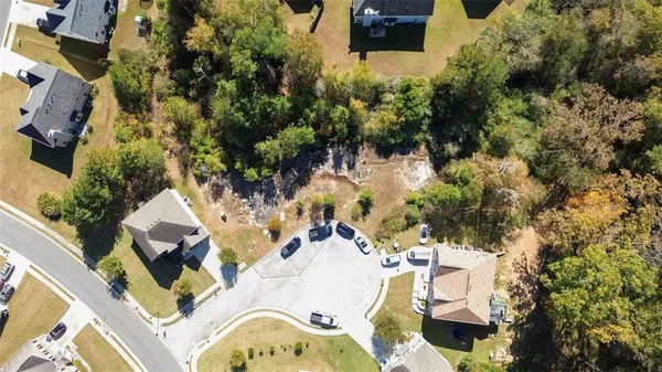 an aerial view of residential house with outdoor space and swimming pool