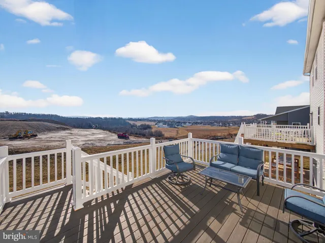 a view of a balcony with wooden floor
