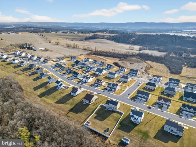 an aerial view of residential building with parking space