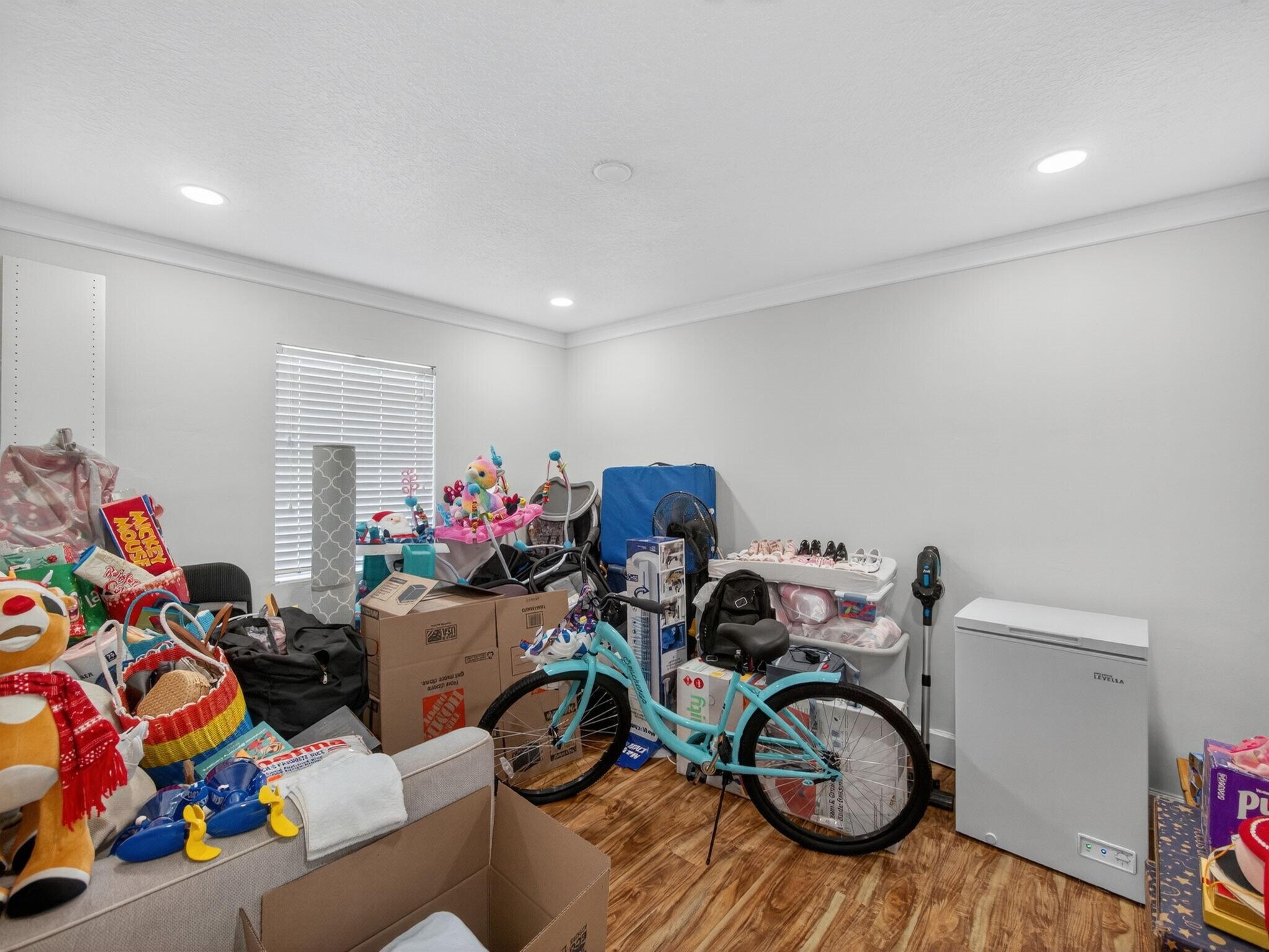 7026 Pine Tree Lane Lake Clarke Shores, FL 33406 - Photo 13 of 22 a view of a room with baby toys