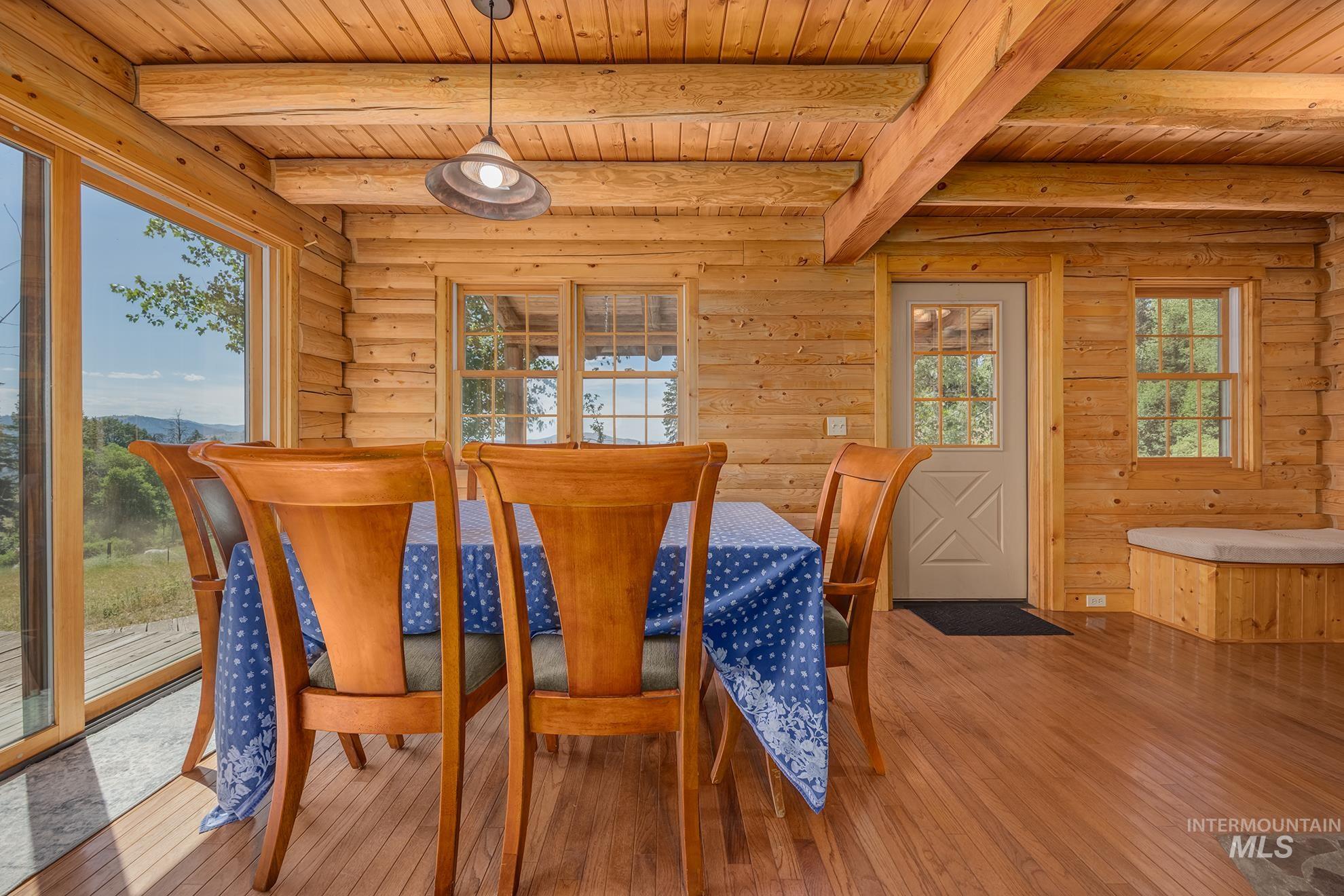 2150 Seid Creek Road Cambridge, ID 83610 - Photo 35 of 50 Wood-finish flooring throughout, complemented by log cabin walls and exposed ceiling beams