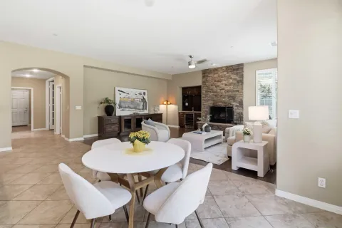 a kitchen with a sink a microwave and cabinets