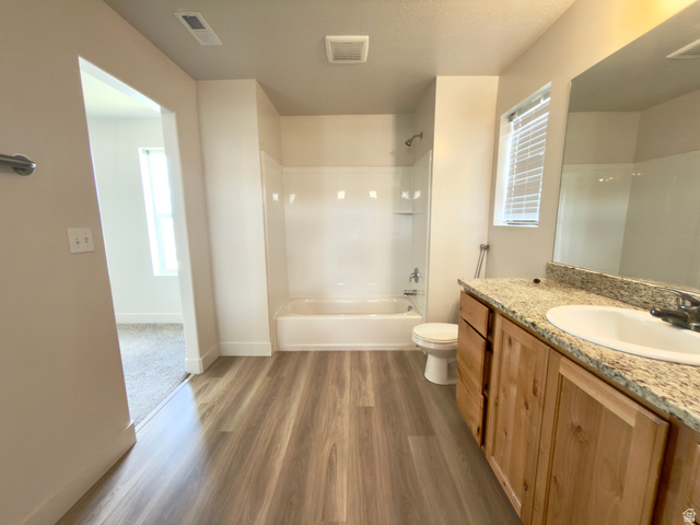 1823 South Longview Road Santaquin, UT 84655 - Photo 53 of 69 Bathroom featuring wood-finish flooring, a vanity with a light-toned countertop, and a white sink