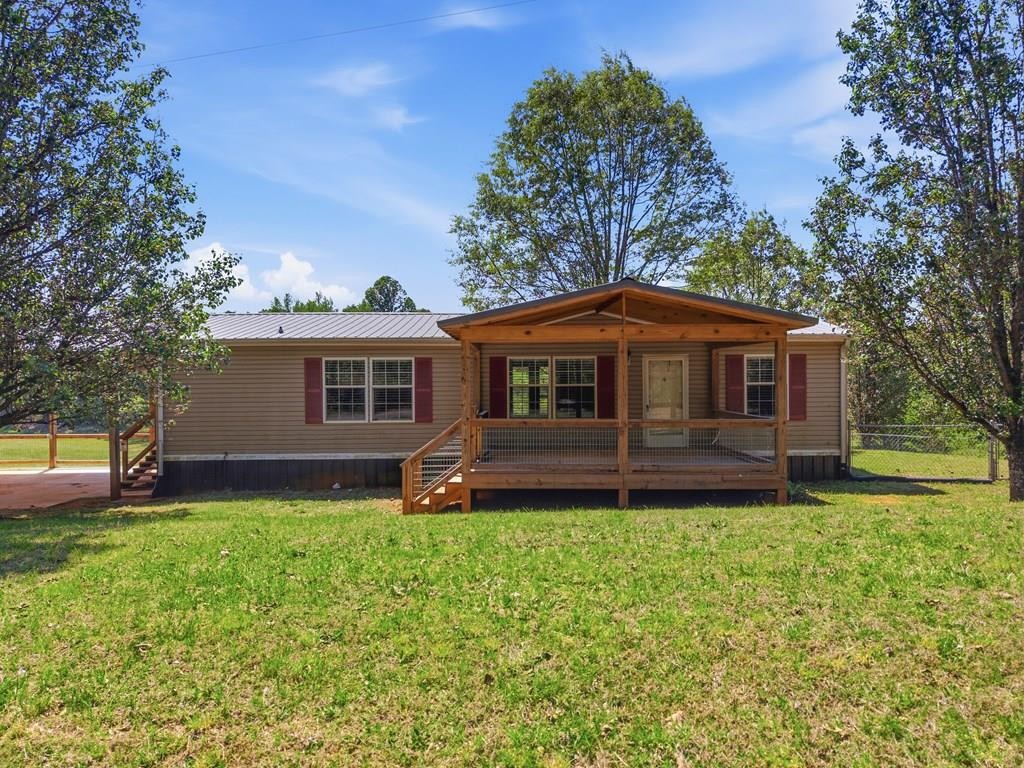 611 Farmer Road Walling, TN 38587 - Photo 1 of 27 a front view of a house with a yard
