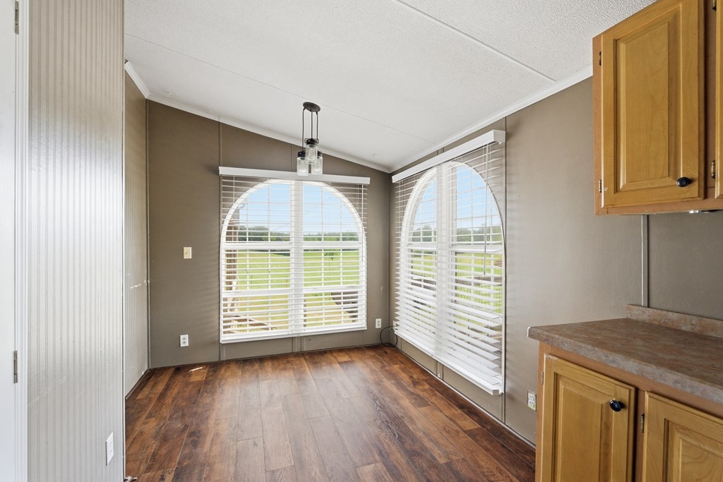 611 Farmer Road Walling, TN 38587 - Photo 14 of 27 a view of a room with wooden floor and fan