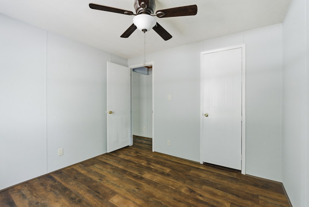611 Farmer Road Walling, TN 38587 - Photo 22 of 27 a view of empty room with wooden floor