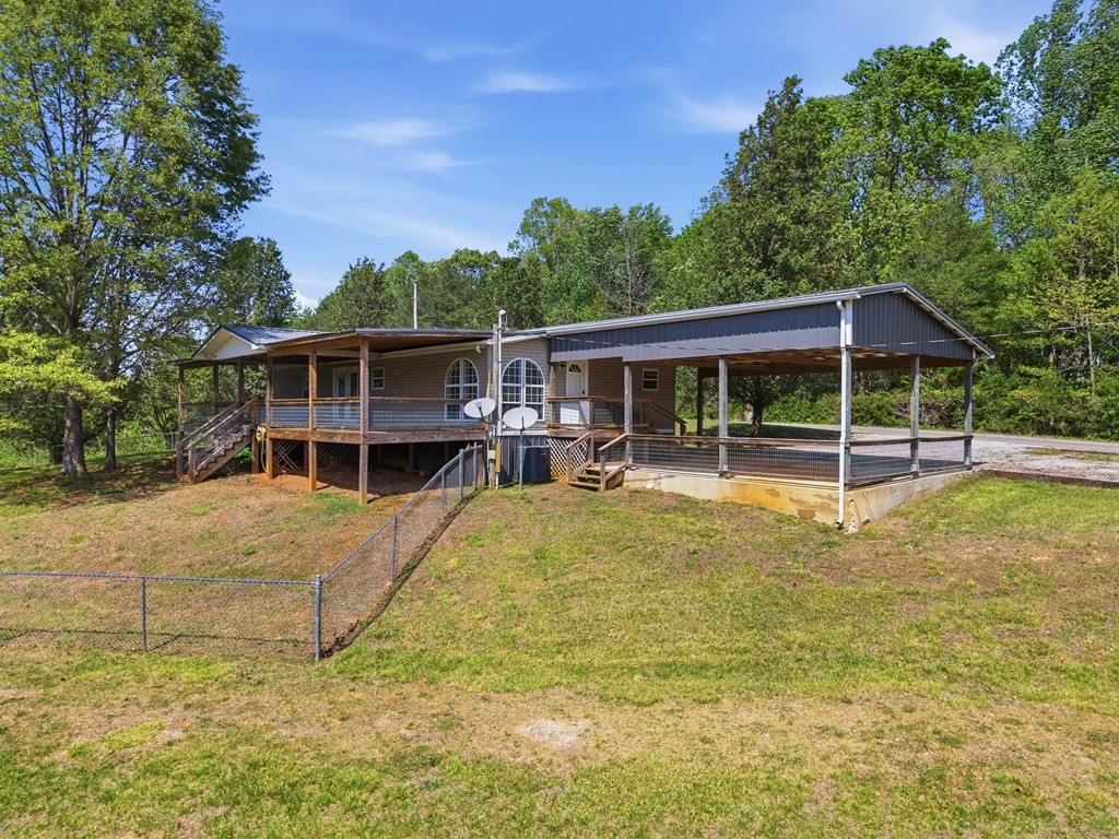 611 Farmer Road Walling, TN 38587 - Photo 4 of 27 a view of a house with a backyard