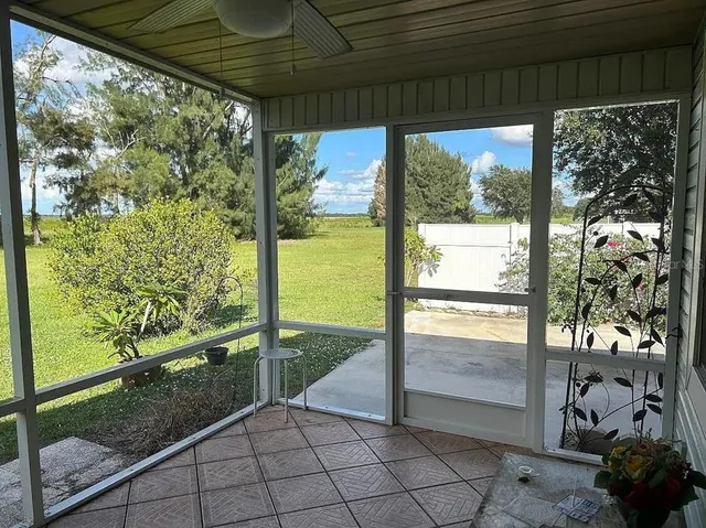 a view of a porch with a large trees