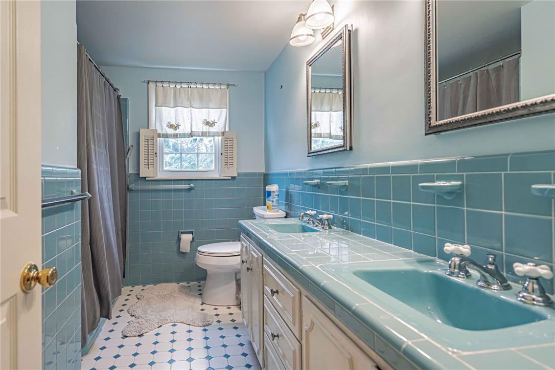 285 Bridle Path Road Bethlehem, PA 18017 - Photo 33 of 54 a bathroom with a granite countertop sink a toilet and a mirror