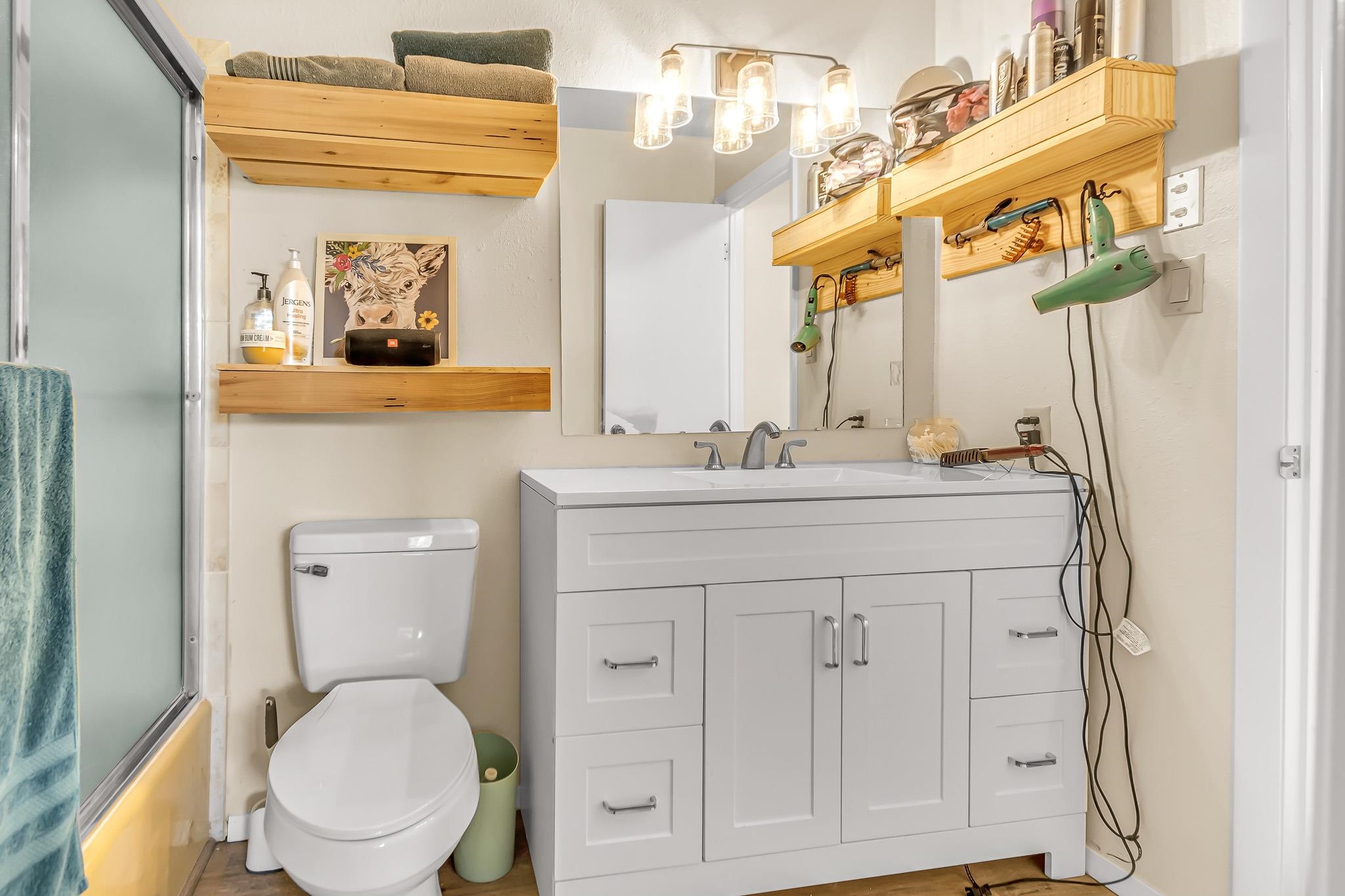 2721 Patterson Road, Unit 902 Grand Junction, CO 81506 - Photo 11 of 19 a bathroom with a toilet sink and mirror