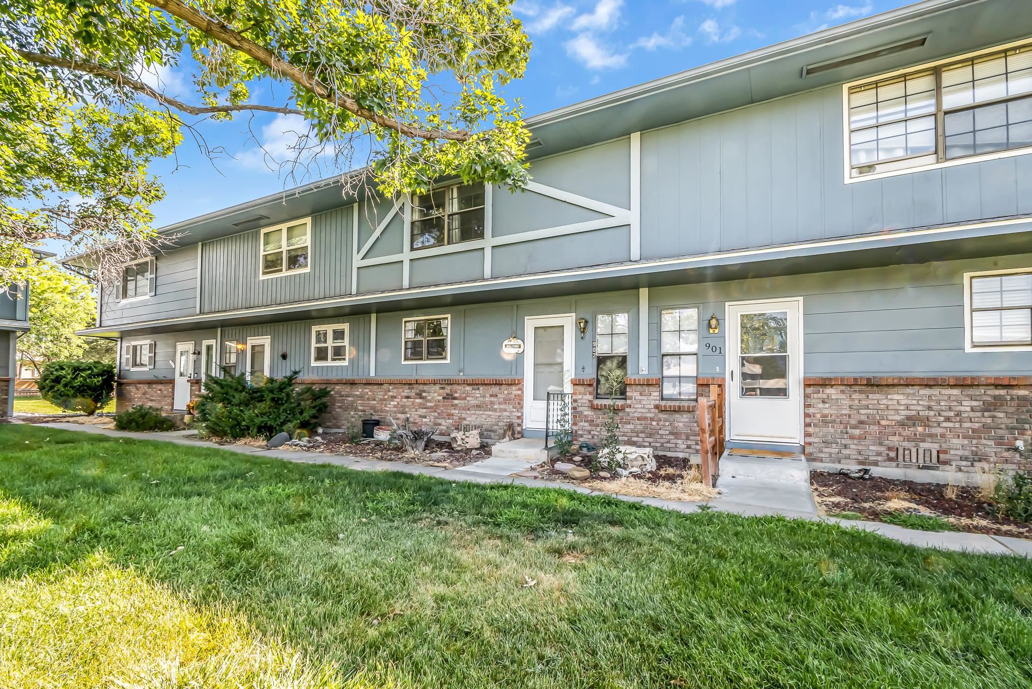 2721 Patterson Road, Unit 902 Grand Junction, CO 81506 - Photo 19 of 19 a front view of a house with garden