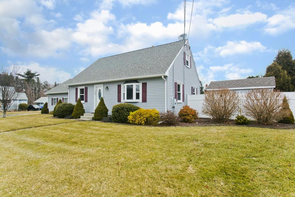 380 Tinkham Road Springfield, MA 01129 - Photo 1 of 42 a view of a house with a yard and garage