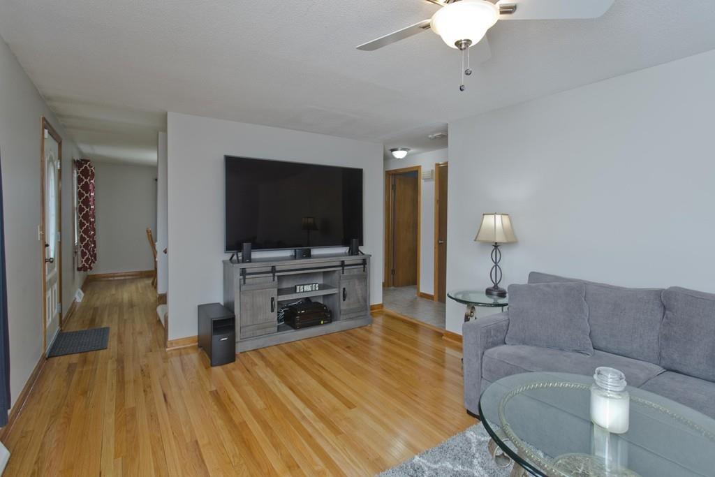 380 Tinkham Road Springfield, MA 01129 - Photo 19 of 42 a living room with furniture and a flat screen tv
